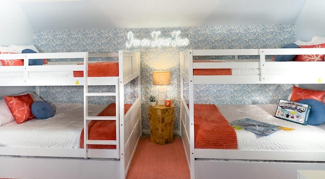 carpeted bedroom with wallpapered walls