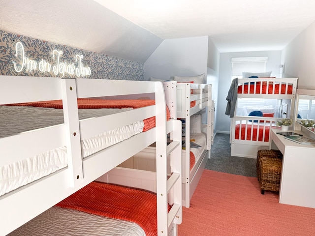 bedroom with carpet flooring and lofted ceiling