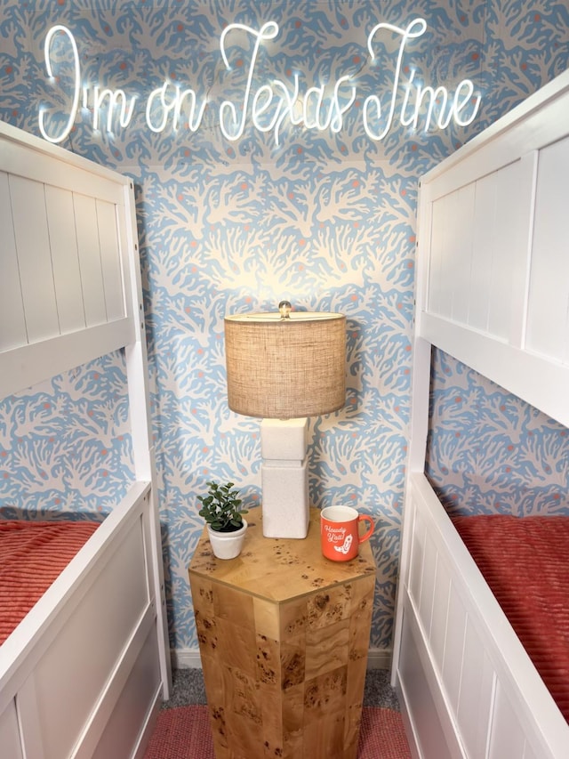detailed view of wallpapered walls and baseboards