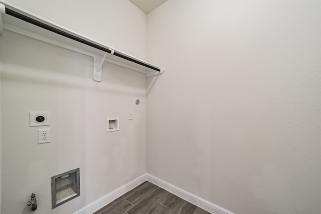 laundry area with hookup for a gas dryer, washer hookup, dark wood-type flooring, and electric dryer hookup