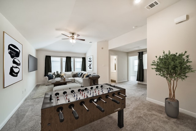 rec room featuring light carpet, vaulted ceiling, and ceiling fan