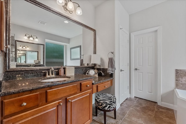 bathroom featuring a washtub and vanity