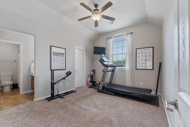 exercise room with ceiling fan, carpet flooring, and vaulted ceiling