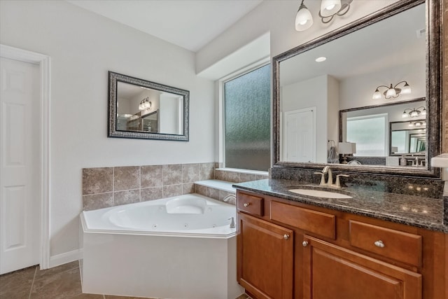 bathroom featuring vanity, a tub to relax in, and tile patterned floors