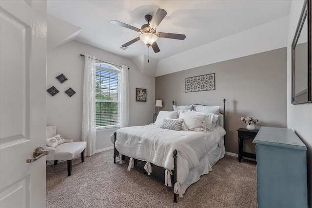 carpeted bedroom featuring ceiling fan and vaulted ceiling