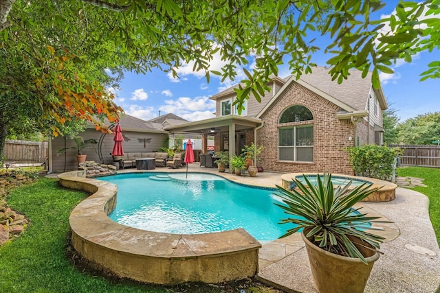 view of pool with ceiling fan and a patio area