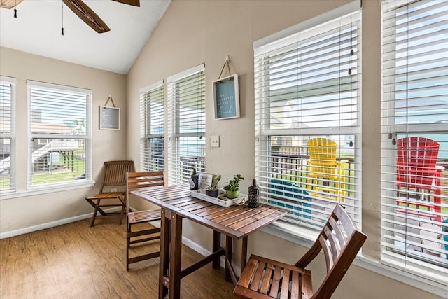 dining area featuring ceiling fan, lofted ceiling, and hardwood / wood-style floors