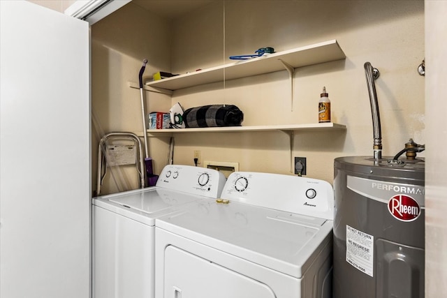 laundry area with water heater and washer and dryer