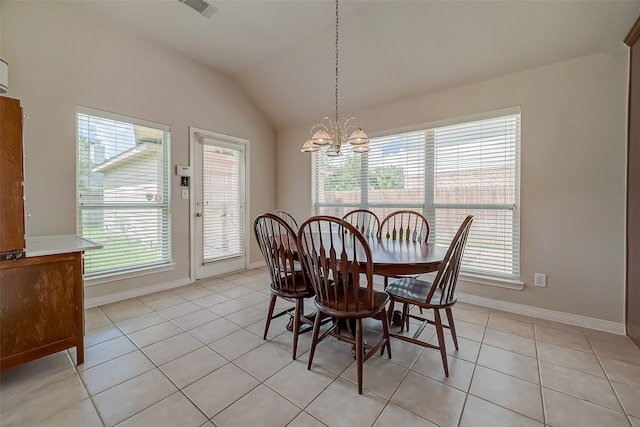 dining area featuring a chandelier, light tile patterned floors, and vaulted ceiling