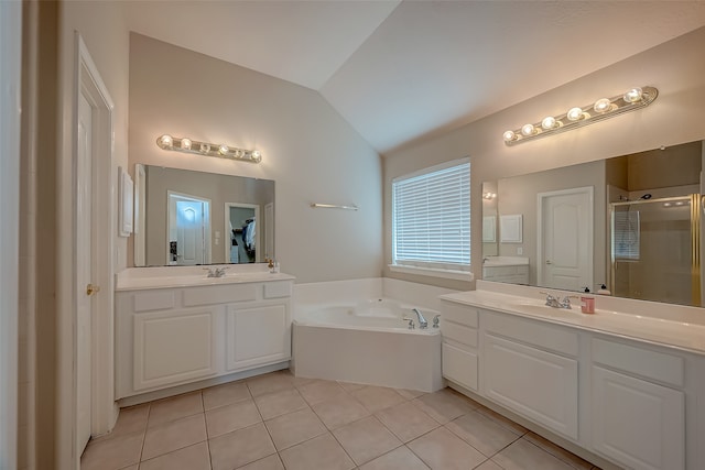 bathroom with tile patterned flooring, vanity, independent shower and bath, and vaulted ceiling