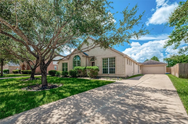 view of front of home with a garage and a front yard