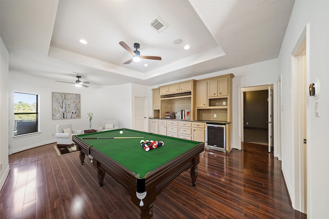 recreation room featuring pool table, a raised ceiling, dark hardwood / wood-style floors, and wine cooler