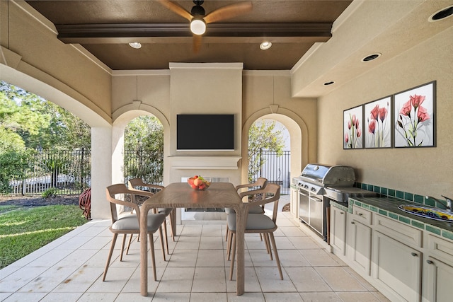 view of patio with an outdoor kitchen and grilling area