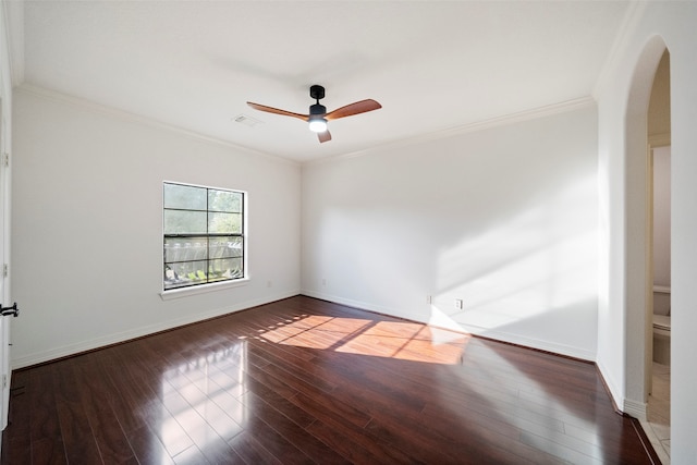 spare room with ceiling fan, crown molding, and dark hardwood / wood-style flooring