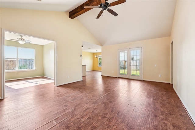 unfurnished living room with beam ceiling, hardwood / wood-style floors, and plenty of natural light