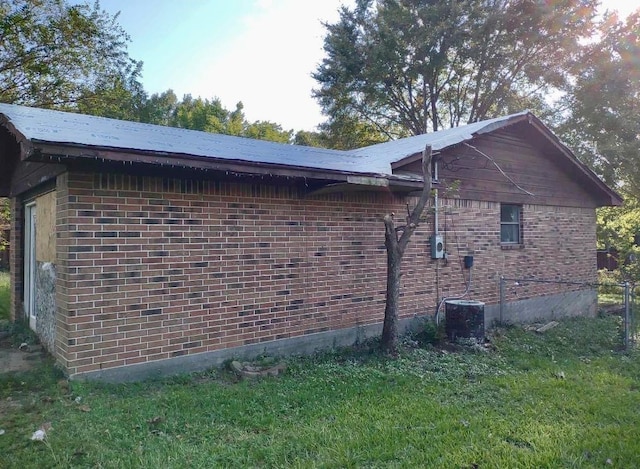 view of property exterior featuring cooling unit and a yard