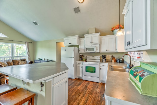 kitchen with hanging light fixtures, white appliances, white cabinetry, and sink