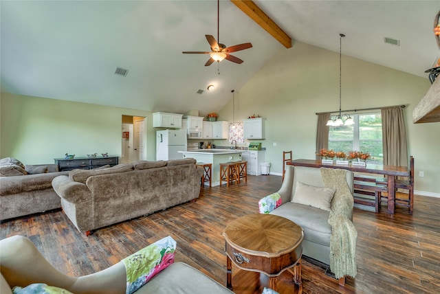 living room with ceiling fan with notable chandelier, beam ceiling, dark hardwood / wood-style flooring, and high vaulted ceiling