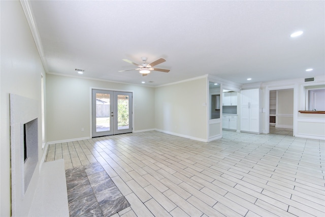 unfurnished living room featuring french doors, ornamental molding, light wood-type flooring, and ceiling fan