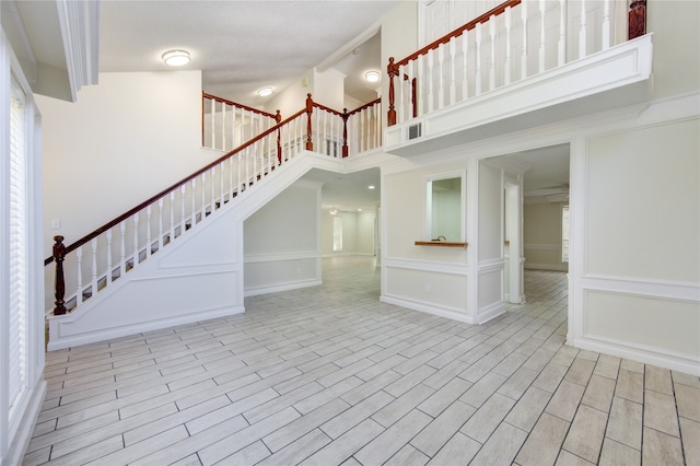 interior space featuring a towering ceiling