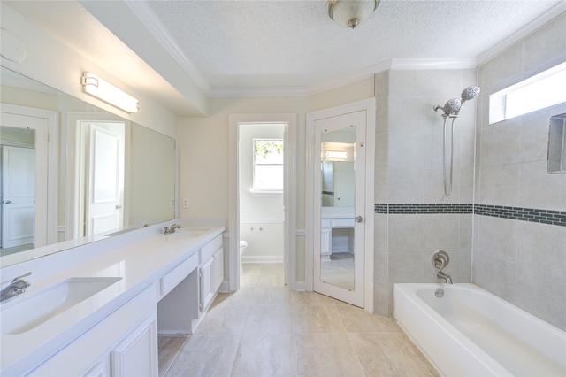 full bathroom featuring a textured ceiling, toilet, ornamental molding, vanity, and tile patterned flooring