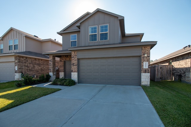 view of front of home featuring a garage and a front lawn