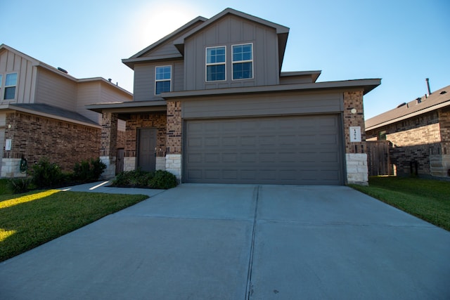 view of front facade with a front yard and a garage