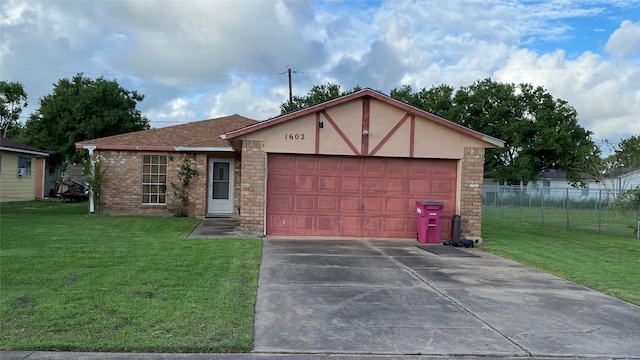 view of front of property featuring a front yard and a garage