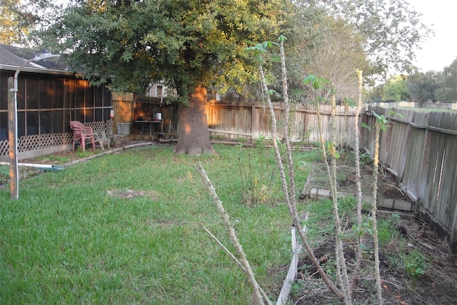 view of yard with a fenced backyard