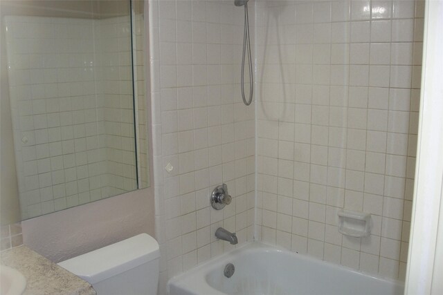 bathroom featuring toilet and shower / tub combination