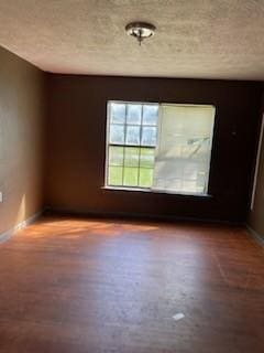 spare room featuring hardwood / wood-style floors