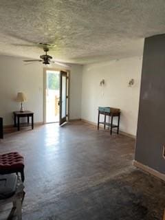 unfurnished living room featuring ceiling fan