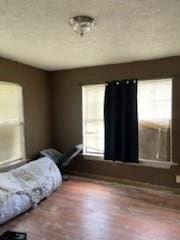 bedroom featuring multiple windows