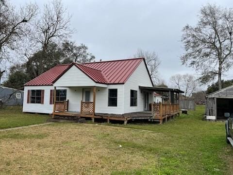 rear view of house with a lawn