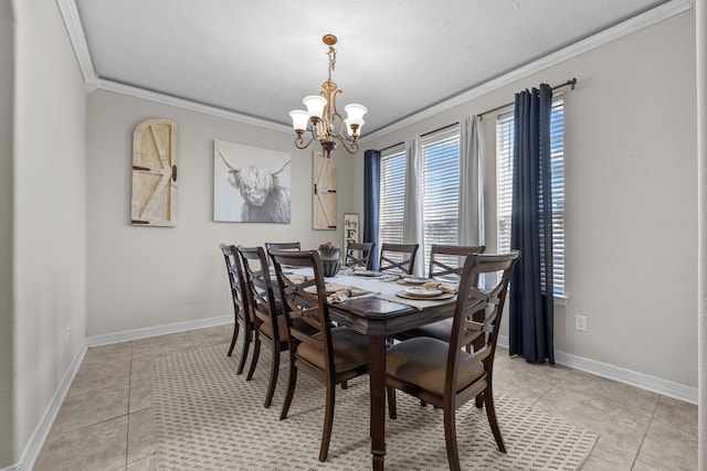 dining area with light tile patterned floors, ornamental molding, baseboards, and a notable chandelier