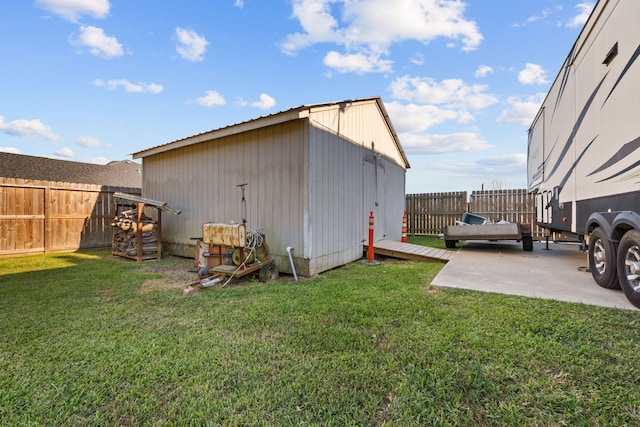 view of outdoor structure featuring a fenced backyard