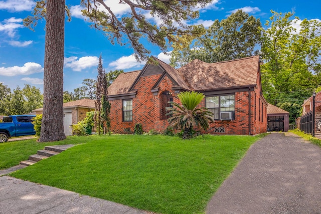 view of front of home featuring cooling unit and a front yard