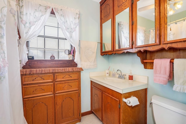 bathroom with vanity and toilet