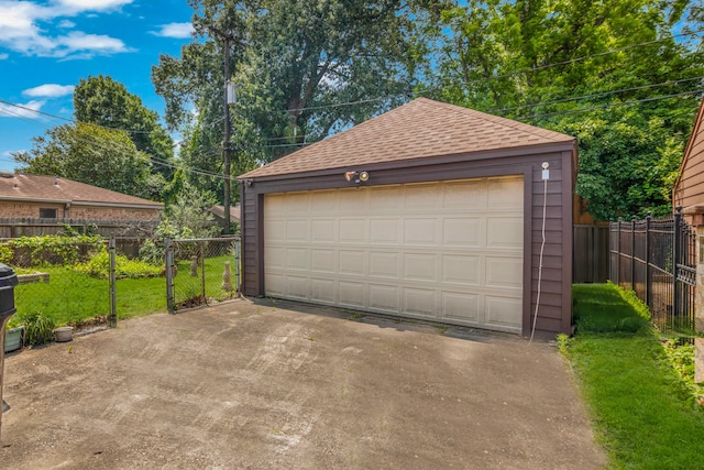 garage featuring a yard