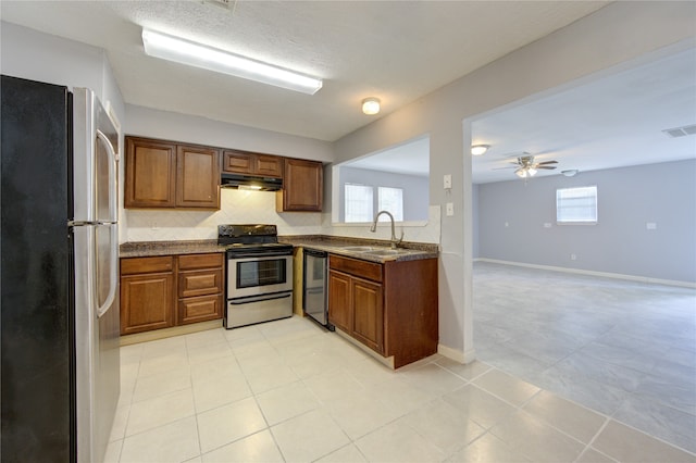 kitchen featuring ceiling fan, light tile patterned flooring, appliances with stainless steel finishes, and sink