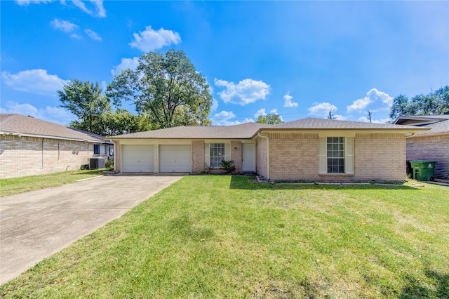 single story home featuring a garage, a front lawn, and central air condition unit