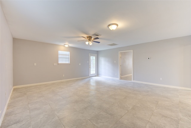 spare room with ceiling fan