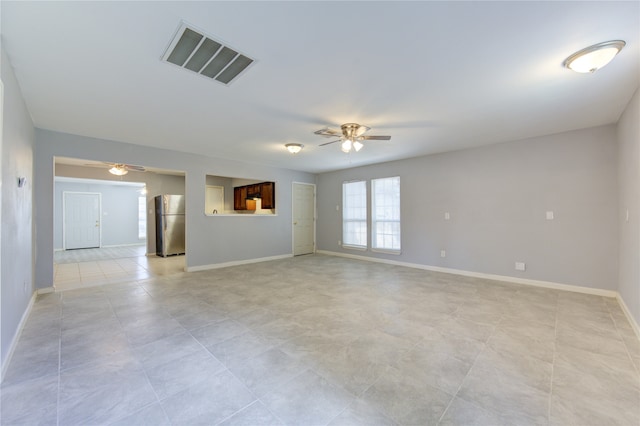 unfurnished room with ceiling fan