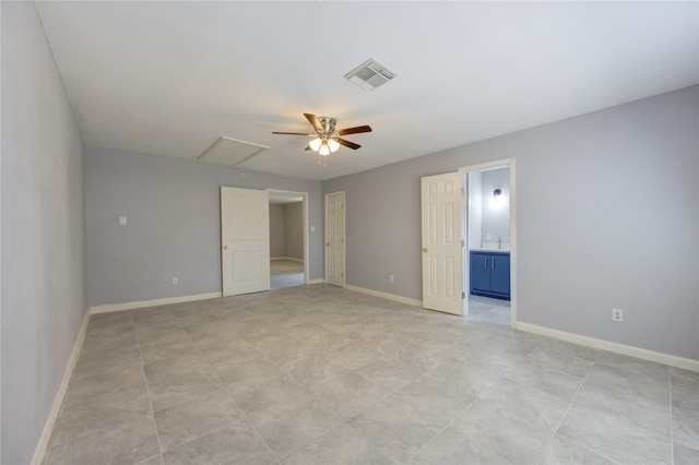 unfurnished bedroom featuring ceiling fan and ensuite bathroom