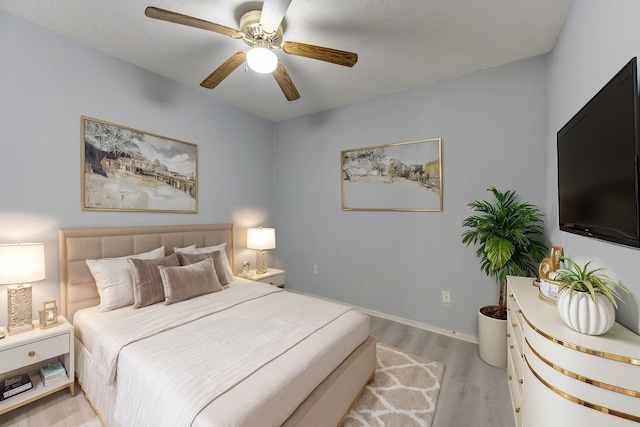 bedroom featuring light hardwood / wood-style floors and ceiling fan