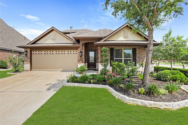 view of front of home with a front yard and a garage