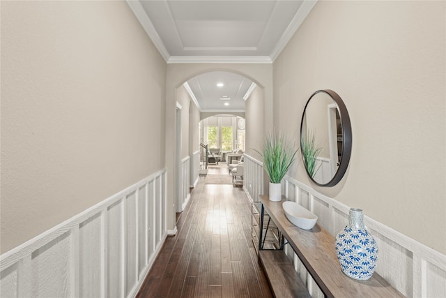 hallway featuring ornamental molding and dark wood-type flooring