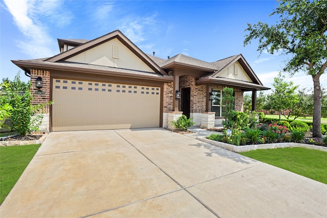 view of front of house with a garage and a front lawn