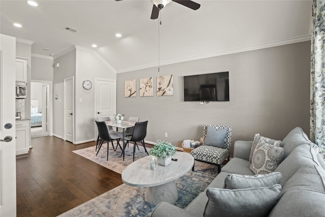 living room featuring lofted ceiling, ceiling fan, crown molding, and dark hardwood / wood-style flooring