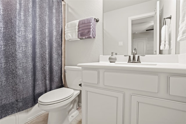 bathroom featuring vanity, toilet, and tile patterned floors